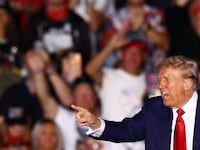 Donald Trump gestures during a rally in Butler.