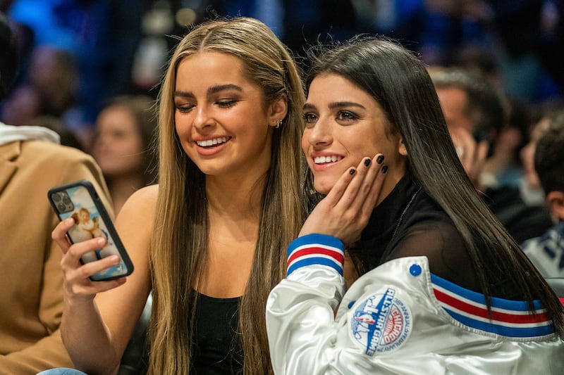 TikTok social media personalities Addison Rae (left) and Dixie D'Amelio (right) during NBA All Star Saturday Night at United Center.