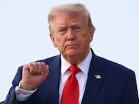 President Donald Trump motions to reporters after getting off Air Force One on July 22, 2026 at Joint Base Andrews, Maryland. Trump is returning from attending a dignified transfer at Dover Air Force Base and a rally in Georgia.