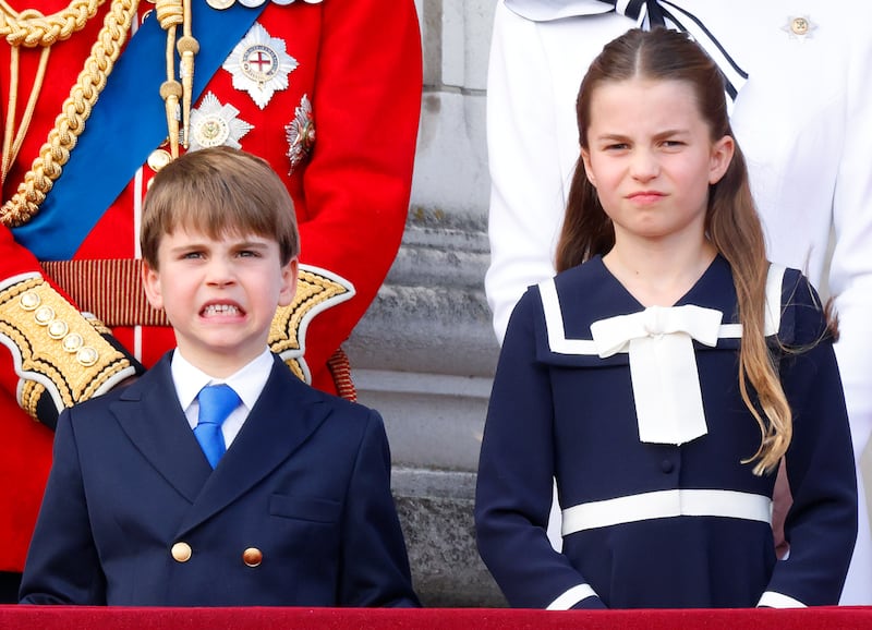 Prince Louis of Wales and Princess Charlotte of Wales watch an RAF flypast from the balcony of Buckingham Palace after attending Trooping the Colour on June 15, 2024 in London, England.