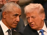 Former US President Barack Obama speaks with President-elect Donald Trump before the State Funeral Service for former US President Jimmy Carter at the Washington National Cathedral in Washington, DC, on January 9, 2025.