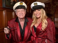 Crystal Hefner poses with Hugh Hefner inside of the Playboy Mansion
