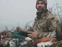 Donald Trump Jr. surrounded by dead waterfowl during a hunting trip in the Venice lagoon in December.
