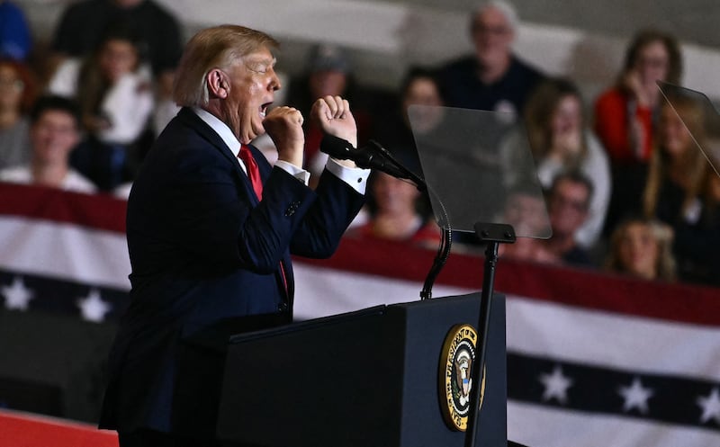 President Donald Trump gestures as he speaks during a campaign rally at T. Ed Garrison Arena in Pendleton, South Carolina on October 21, 2026.