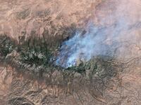 NEW MEXICO, USA - 17 MAY 2026: Satellite view of the Seven Cabins fire in the Capitan Mountain Wilderness, New Mexico. The blaze, which erupted on May 14 after a Trans Aero MedEvac medical transport plane crashed along its flightpath from Roswell to Sierra Blanca Regional Airport, has scorched nearly 9,000 acres and remains uncontained, sending thick smoke plumes across Lincoln County. Imaged 17 May 2026. (Photo by Gallo Images/Orbital Horizon/Copernicus Sentinel Data 2026)