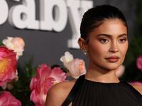 Kylie Jenner poses on a redcarpet for the Baby2Baby gala