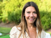 A photo of a smiling Libbie Mugrabi at an outdoor event.