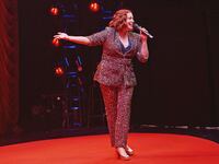 Rachel Bloom on stage at her show “Death, Let Me Do My Show”
