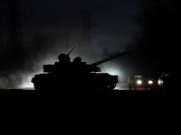 2022-02-22T064259Z_1788944394_RC2NOS9E3001_RTRMADP_3_UKRAINE-CRISIS-DONETSK-TANKS_vzxkgx