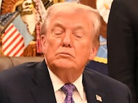 US President Donald Trump (C) and US Secretary of Commerce Howard Lutnick (R) listen as US Senator Ted Cruz (R-TX) (L) speaks during a signing ceremony on AI the Oval Office of the White House in Washington, DC, on December 11, 2025.