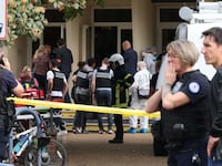 French police officers from the forensic service stand in front of the Gambetta high school in Arras, northeastern France on October 13, 2023.