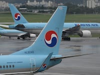 Korean Air planes are parked on the tarmac ahead of the arrival of Typhoon Maysak at Gimpo domestic airport in Seoul on September 2, 2020.