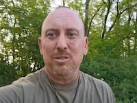 Derek Huffman, 45, of Texas, records a video during training after joining the Russian military.