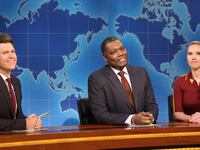 SATURDAY NIGHT LIVE -- Episode 1884 -- Pictured: (l-r) Anchor Colin Jost, anchor Michael Che, and host Scarlett Johansson during Weekend Update on Saturday, May 17, 2025 -- (Photo by: Will Heath/NBC via Getty Images)