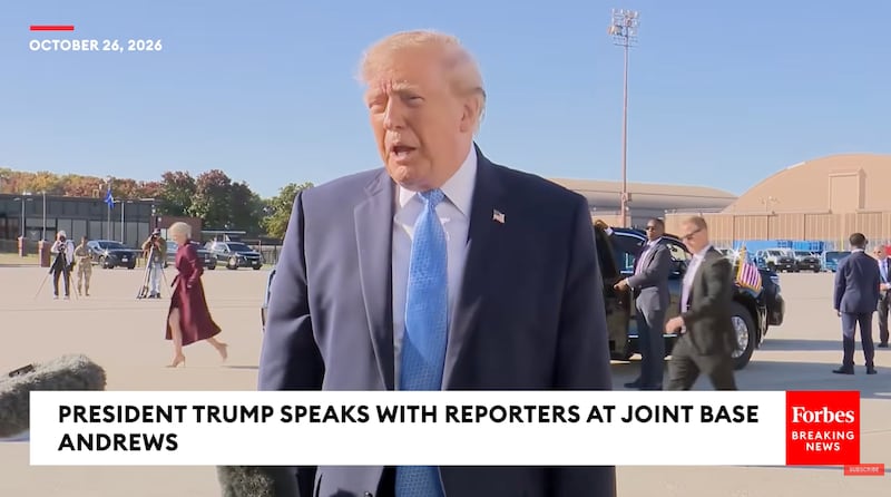 Harp departs the presidential limousine and heads for Air Force One while Trump talks to the press.