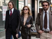 articles/2013/12/10/american-hustle-a-sexy-gleefully-chaotic-caper-starring-christian-bale-and-jennifer-lawrence/131209-stern-hustle2-tease_cokqrg