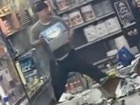 J Dustin D. Cain destroying beer in a Walmart in Topeka, Kansas.
