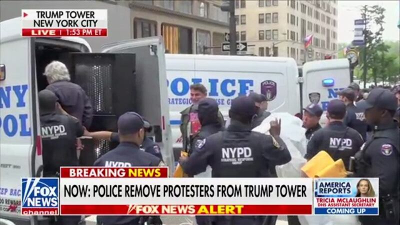Protesters opposing Immigration and Customs Enforcement were removed from the Trump Tower lobby Monday afternoon.