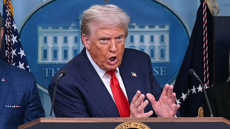 TOPSHOT - US President Donald Trump, alongside Secretary of Defense Pete Hegseth (L) and Attorney General Pam Bondi (R), speaks during a news conference to discuss crime in Washington, DC, in the Brady Press Briefing Room at the White House in Washington, DC, on August 11, 2025. President Donald Trump announced Monday that he was deploying National Guard troops and putting the Washington police force under federal control to tackle crime in the US capital. "This is Liberation Day in DC, and we're going to take our capital back," Trump said at a White House press conference. (Photo by ANDREW CABALLERO-REYNOLDS / AFP) (Photo by ANDREW CABALLERO-REYNOLDS/AFP via Getty Images)