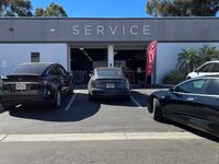 A Tesla electric sedan is pulling into a Tesla service center in the Kearny Mesa region, in San Diego, California