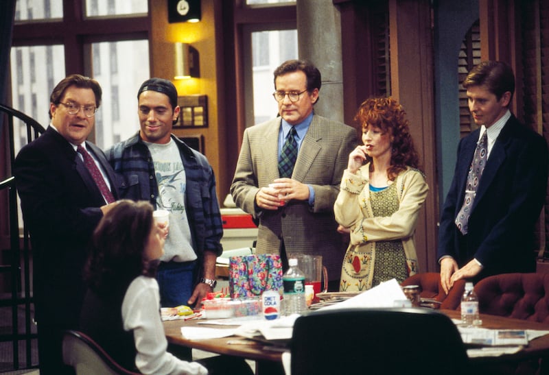 NEWSRADIO -- Pictured: (l-r) Stephen Root as Jimmy James, Maura Tierney as Lisa Miller (seated), Joe Rogan as Joe Garrelli, Phil Hartman as Bill McNeal, Vicki Lewis as Beth, Dave Foley as Dave Nelson (Photo by J. Delvalle/NBCU Photo Bank/NBCUniversal via Getty Images via Getty Images)