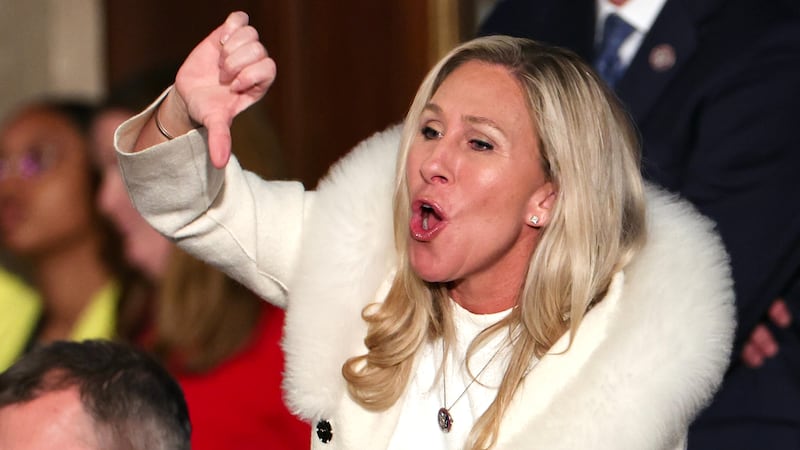WASHINGTON, DC - FEBRUARY 07: U.S. Rep. Marjorie Taylor Greene (R-GA) gives a thumbs down during President Joe Biden's State of the Union address during a joint meeting of Congress in the House Chamber of the U.S. Capitol on February 07, 2023 in Washington, DC. The speech marks Biden's first address to the new Republican-controlled House.