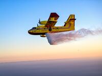 A CL-415 Super Scooper drops water during a demonstration in Los Angeles in 2022.