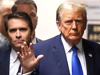 NEW YORK, NEW YORK - APRIL 18: Former U.S. President Donald Trump waves as he returns to the courtroom with attorney Todd Blanche during a recess in his criminal trial as jury selection continues at Manhattan Criminal Court on April 18, 2024 in New York City. Trump was charged with 34 counts of falsifying business records last year, which prosecutors say was an effort to hide a potential sex scandal, both before and after the 2016 presidential election. Trump is the first former U.S. president to face trial on criminal charges. (Photo by Brendan McDermid-Pool/Getty Images)