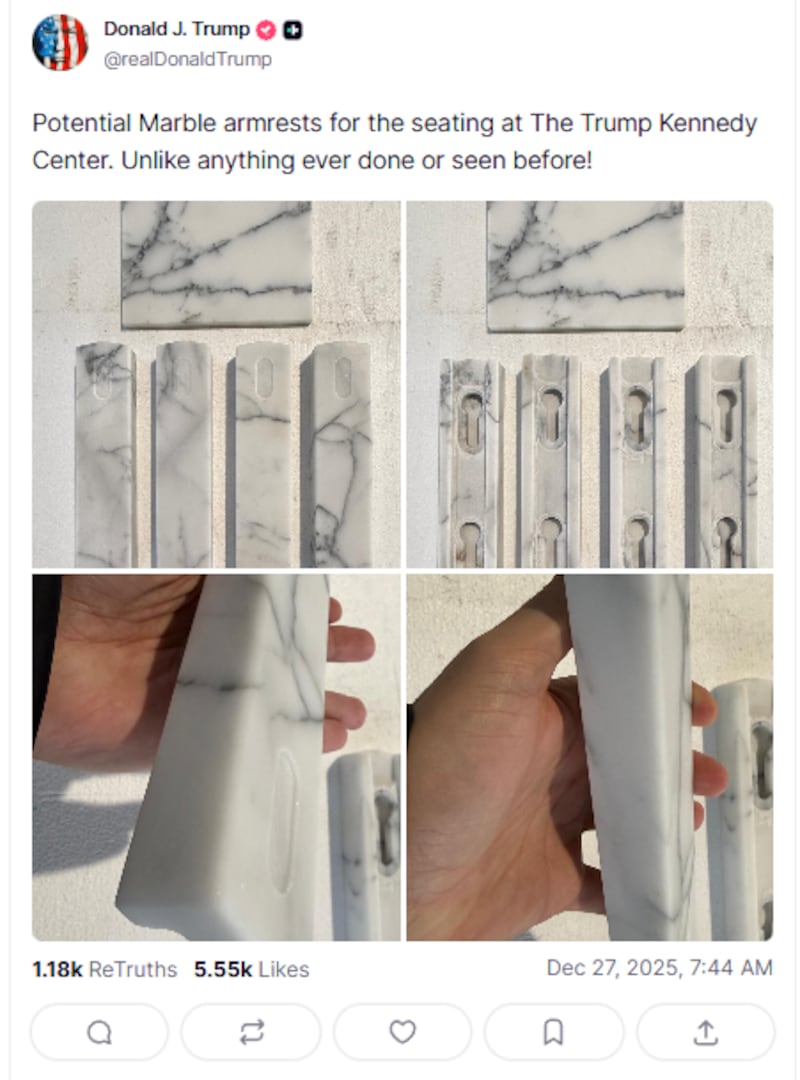 President Donald Trump shows off his new marble armrests for the Kennedy Center.
