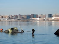 In this U.S. Coast Guard handout, the Coast Guard investigates aircraft wreckage on the Potomac River on January 30, 2025 in Washington, DC. An American Airlines flight from Wichita, Kansas collided midair with a military Black Hawk helicopter while on approach to Ronald Reagan Washington National Airport outside of Washington, DC. According to reports, there were no survivors among the 67 people onboard both aircraft.