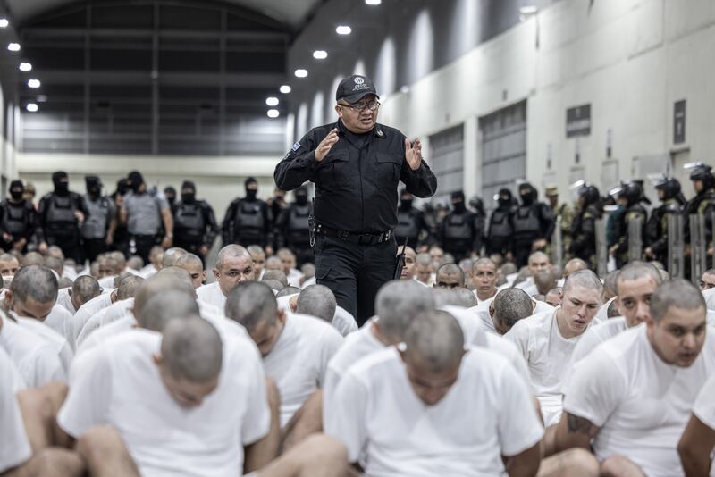 SAN SALVADOR, EL SALVADOR - MARCH 16: (----EDITORIAL USE ONLY - MANDATORY CREDIT - 'EL SALVADOR PRESIDENCY / HANDOUT' - NO MARKETING NO ADVERTISING CAMPAIGNS - DISTRIBUTED AS A SERVICE TO CLIENTS----) More than 250 suspected gang members arrive in El Salvador by plane, including 238 members of Venezuela's Tren de Aragua gang and 23 members of the MS-13 gang, who were deported to El Salvador by the US in San Salvador, El Salvador on March 16, 2025. El Salvador's President Nayib Bukele confirmed they will be sent to the country's infamous mega-prison at CECOP facility prison. San Salvador forces took heavy security measures. (Photo by El Salvador Presidency / Handout/Anadolu via Getty Images)