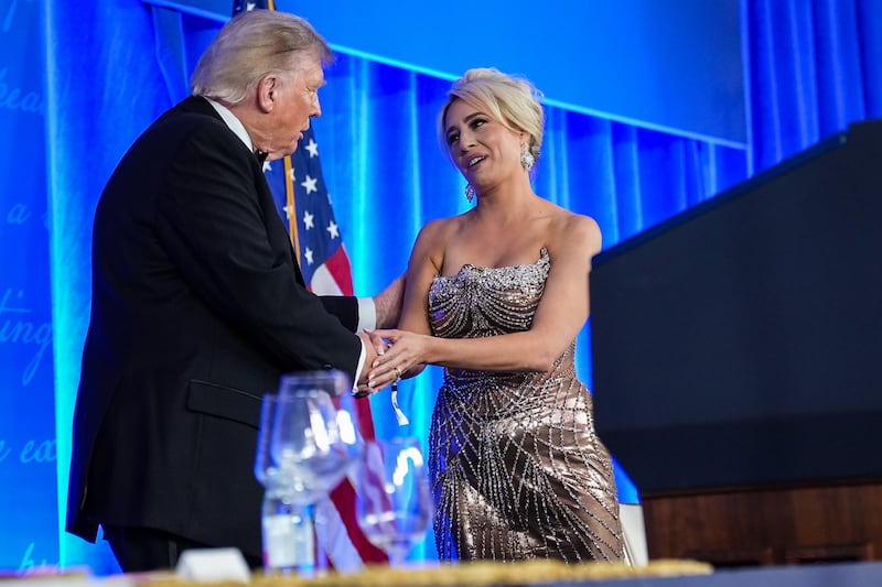 WASHINGTON, DC - JULY 24: U.S. President Donald Trump greets White House Correspondents Association President Jacqui Heinrich during the re-scheduled White House Correspondents Dinner in the Presidential Ballroom at the Waldorf Astoria on July 24, 2026 in Washington, DC. The annual gala hosted by the White House Correspondents Association was re-scheduled to tonight after the original event in April was cut short when an armed man, later identified as Cole Tomas Allen, attempted to get past a Secret Service checkpoint. (Photo by Eric Lee/Getty Images)