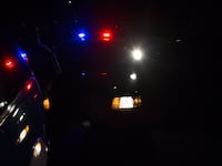 Nighttime view of police car