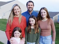 Derrick Anderson with a woman and kids who are not his own.