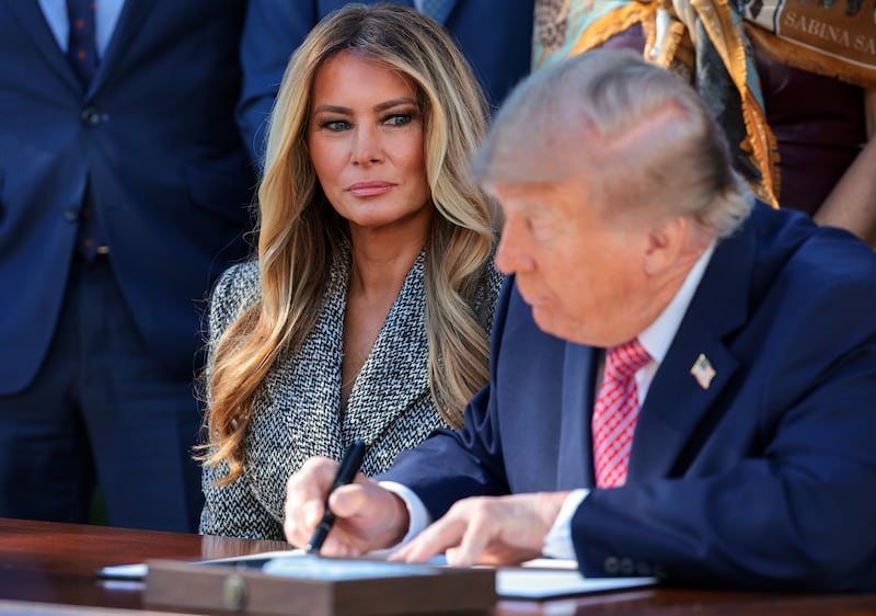First lady Melania Trump watches as U.S. President Donald Trump signs an executive order in the Rose Garden of the White House on October 19, 2026 in Washington, DC. With the support and urging of the first lady, the executive order establishes the Women’s Health Division at the National Institutes of Health and a White House Women’s Health Task Force.