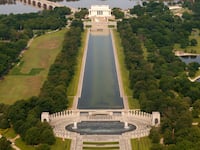 Algae can be seen at the bottom of the reflecting pool in this June aerial image.
