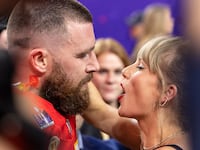 Travis Kelce #87 of the Kansas City Chiefs and Taylor Swift