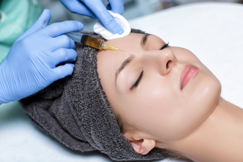 procedure Plasmolifting injection. plasma injection into the skin of the forehead of the patient