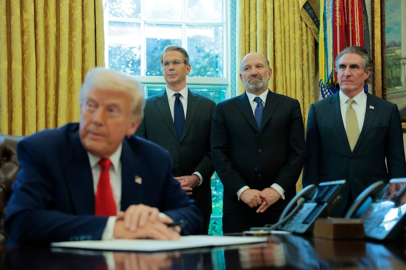 President Donald Trump signs an executive order as (L-R) U.S. Treasury Secretary Scott Bessent, Secretary of Commerce Howard Lutnick and Interior Secretary Doug Burgum look on in the Oval Office of the White House on April 09, 2025 in Washington, DC.