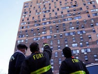 2022-01-10T232302Z_790595066_RC2EWR9RTEID_RTRMADP_3_NEW-YORK-FIRE-BRONX-GAMBIANS_m1ztiz