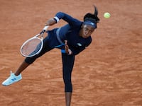 Coco Gauff serving.