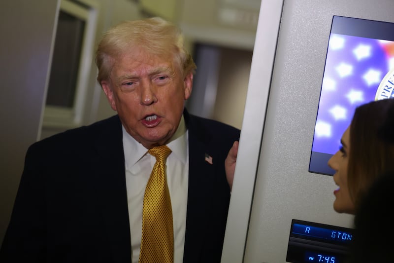 President Donald Trump speaks to the media aboard Air Force One en route to Washington, DC on January 04, 2026.