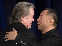 Former White House Chief Strategist Steve Bannon (L) greets Chinese billionaire Guo Wengui