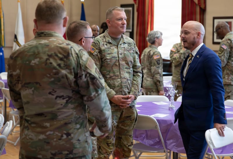 Ryan Higgins, a senior advisor to the Secretary of Defense, greets National Guard leadership at the District of Columbia National Guard Joint Interagency Spiritual Resiliency Luncheon at the DC Armory in Washington, June 9, 2026. About 3,000 National Guard members are supporting the mission, providing critical assistance to the Metropolitan Police Department to help ensure the safety of residents, commuters and visitors throughout the District.