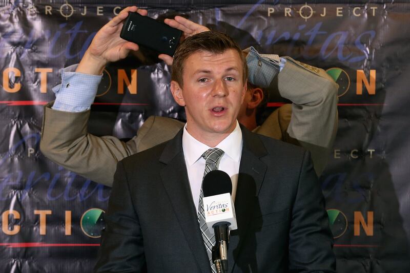 WASHINGTON, DC - SEPTEMBER 01: Conservative undercover journalist James O'Keefe (L) is photographed by Project Veritas Action Senior Communications Strategist Stephen Gordon during a news conference at the National Press Club September 1, 2015 in Washington, DC. O'Keefe released a video of that accuses the Democratic frontrunner Hillary Clinton's director of marketing and FEC compliance director of breaking the law by allowing a Canadian tourist to buy $75 of campaign swag using the Project Veritas Action journalist as a straw purchaser. O'Keefe promised that people will resign from their jobs as his "Army of Exposers" record and release more undercover videos during the 2016 campaign. (Photo by Chip Somodevilla/Getty Images)
