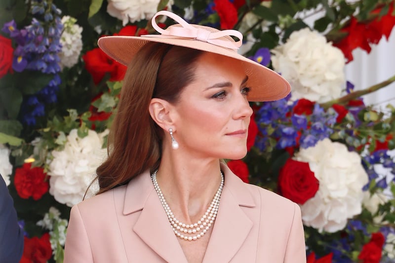 A beaming Kate Middleton earlier in the day