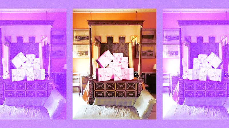 A photo illustration of the inlaid four-poster bed in Plum Sykes' cousin Christopher Simon Sykes’ childhood bedroom at Sledmere House, Yorkshire with gifts on them.