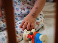 articles/2014/10/30/couple-sues-over-russian-bait-and-switch-adoption-of-disabled-kids/141029-traster-adoption-tease_kujr1a