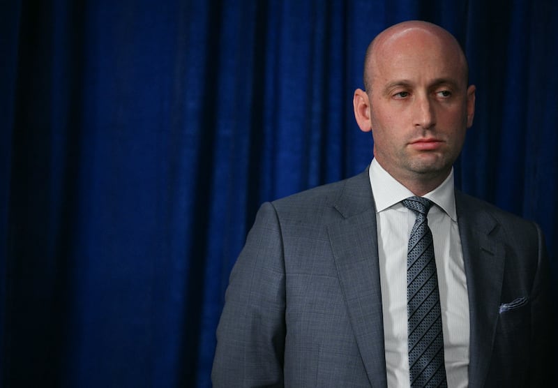 White House Deputy Chief of Staff Stephen Miller looks on as President Donald Trump speaks to the press following US military actions in Venezuela, at his Mar-a-Lago residence in Palm Beach, Florida, on January 3, 2026.