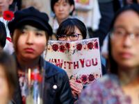 Protesters gather at the rally called 'Flower Demo' to criticize recent acquittals in court cases of alleged rape in Japan and call for revision of the anti-sex crime law, in front of Tokyo Station in Tokyo, Japan June 11, 2019.